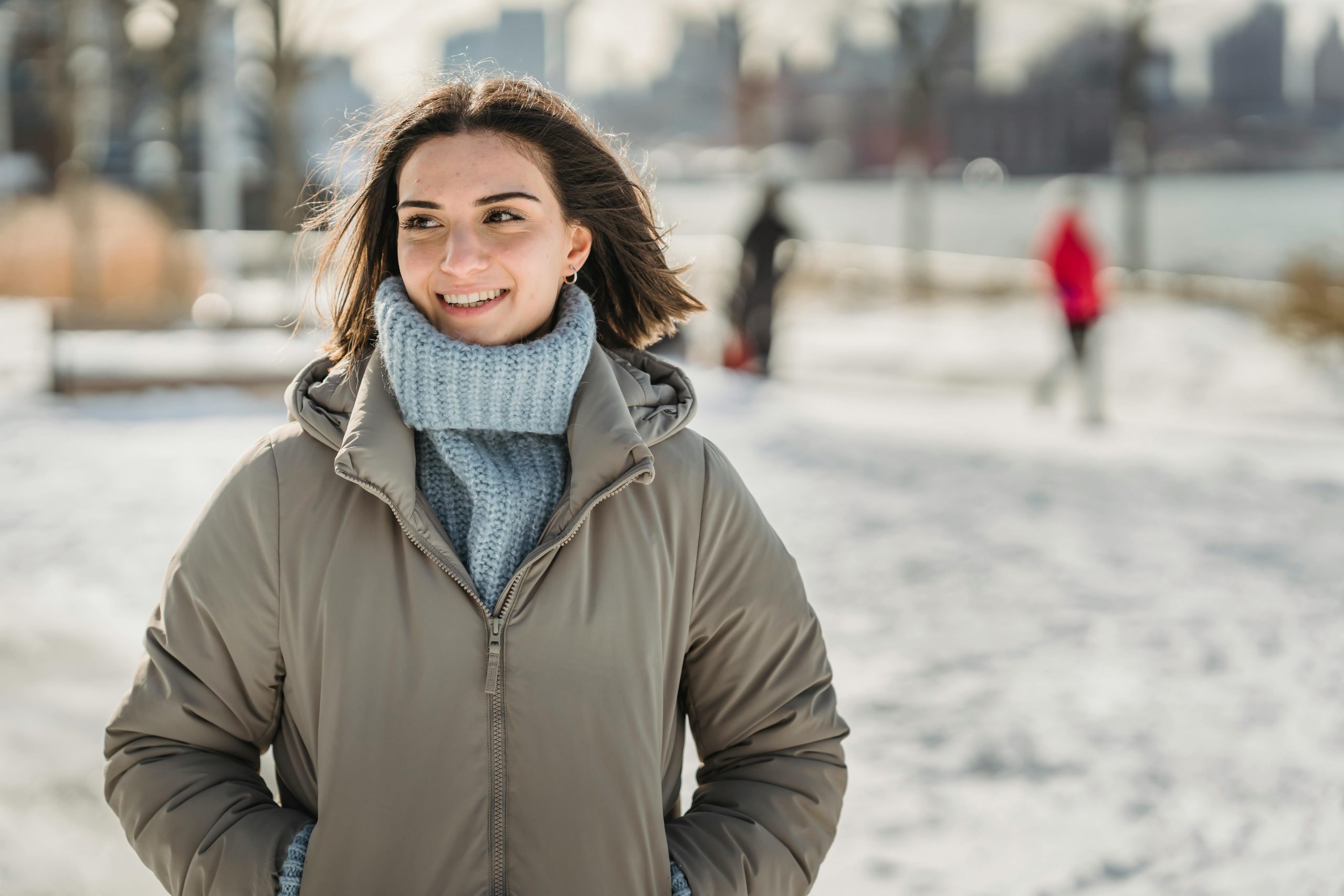 smiling woman dressed in heavy winter clothing